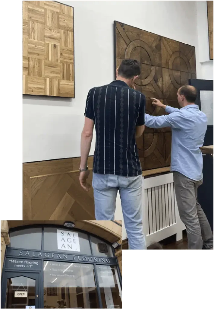 Men viewing wooden wall art in flooring showroom display