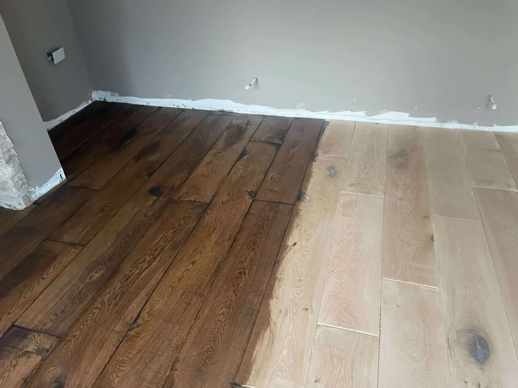 Wooden flooring installation in progress with colour variation