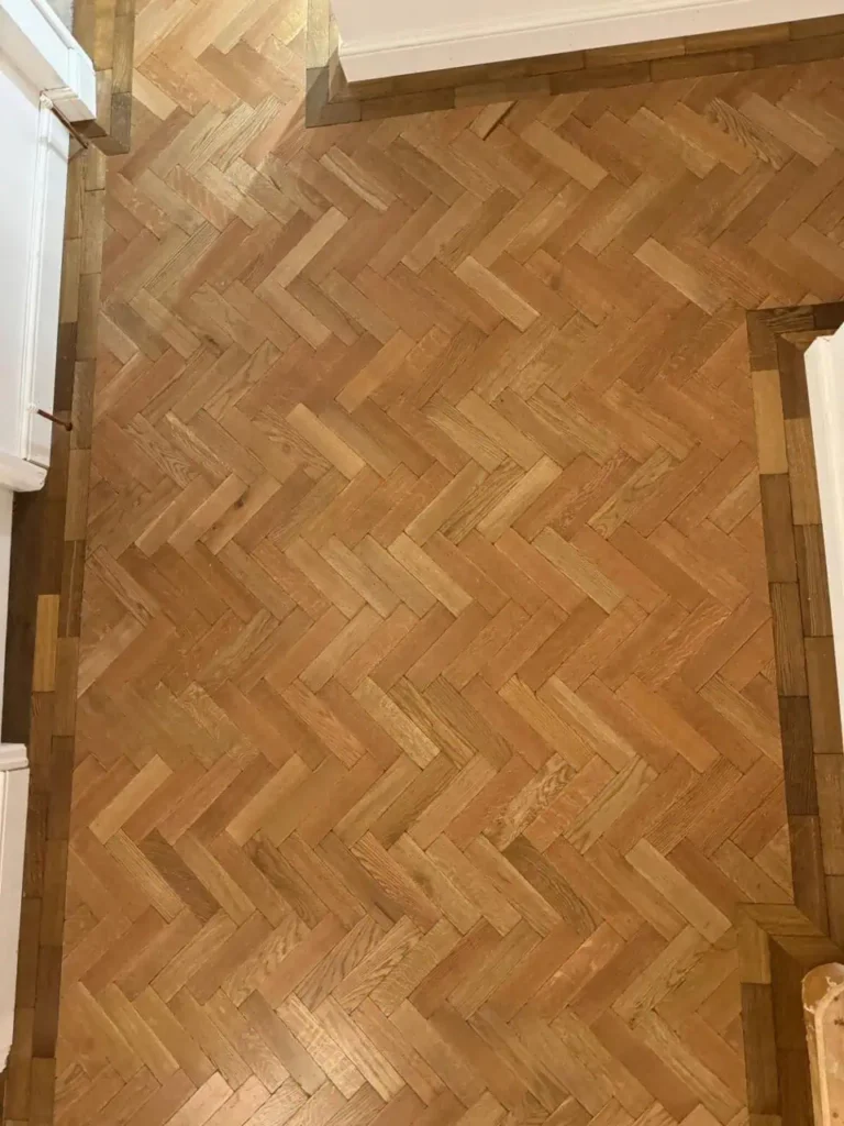 Herringbone parquet wooden flooring in light oak finish