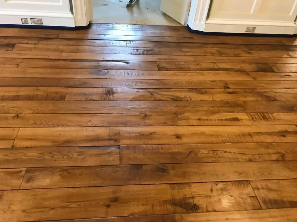 Wooden hardwood flooring with water damage stains
