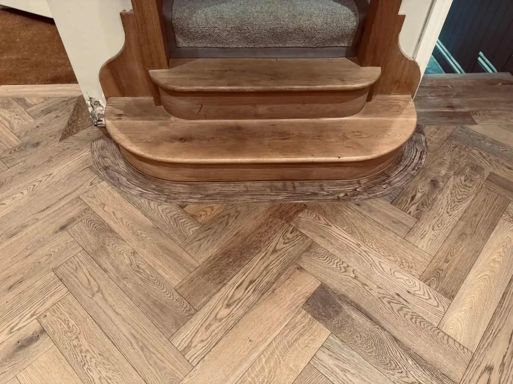 Wooden chair on herringbone pattern wood flooring