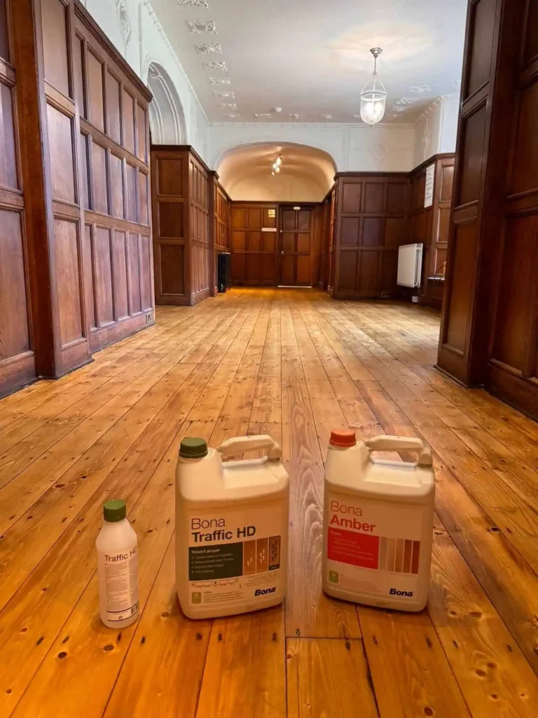 Empty wooden hall with Bona floor cleaning products displayed