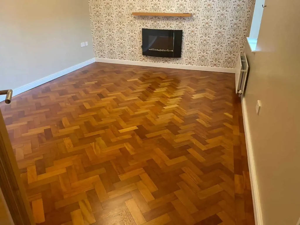 Modern living room with herringbone wood floor and fireplace