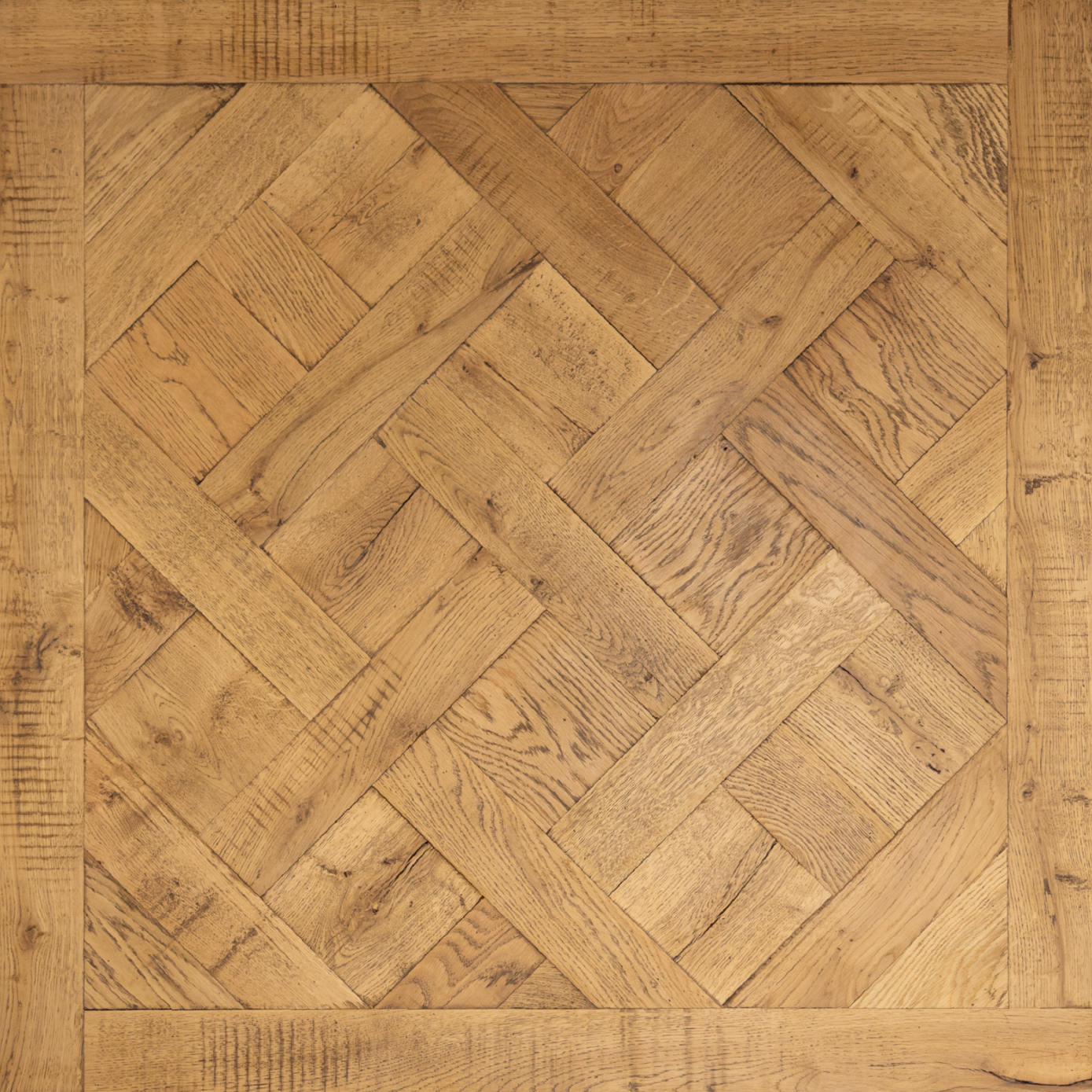 Herringbone pattern wooden parquet floor with border