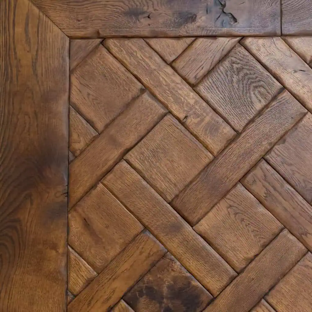 Herringbone pattern wooden floor with natural grain details