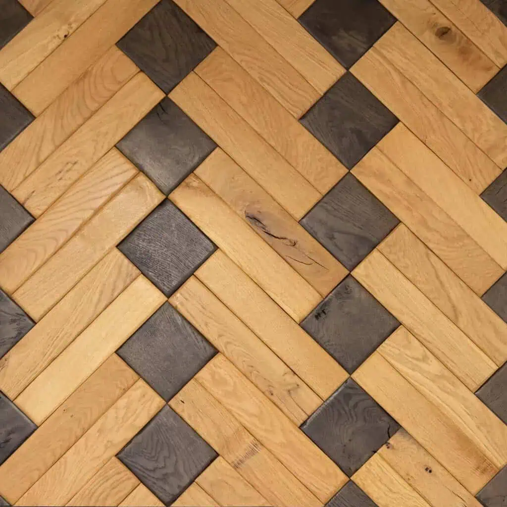Herringbone pattern wooden floor with light and dark tiles