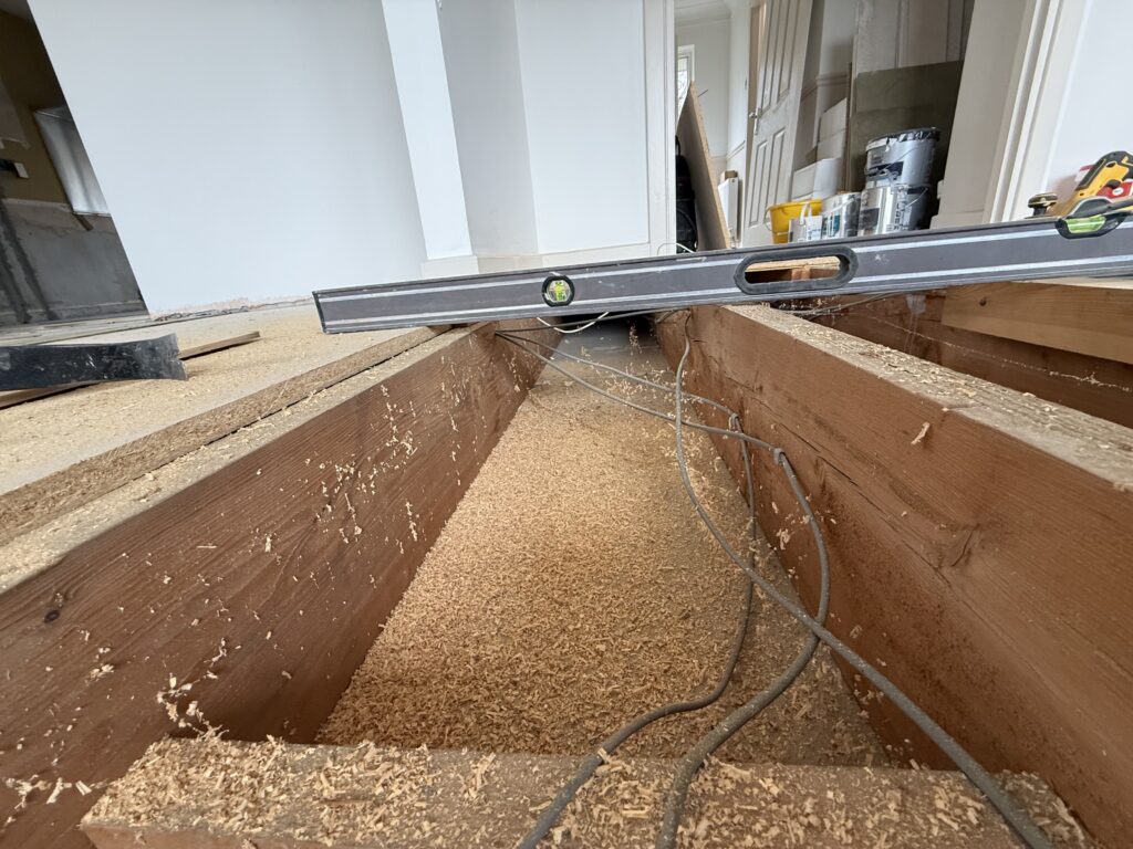 Construction site with wooden frames and spirit level tool
