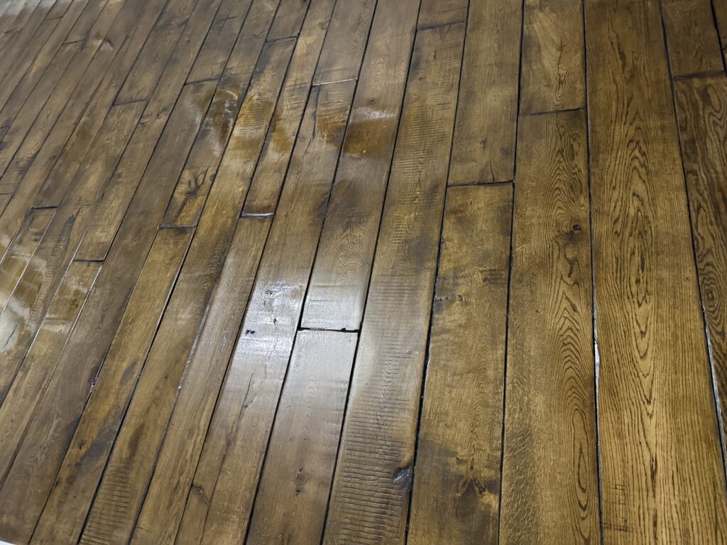 Wooden hardwood floor with random plank layout pattern