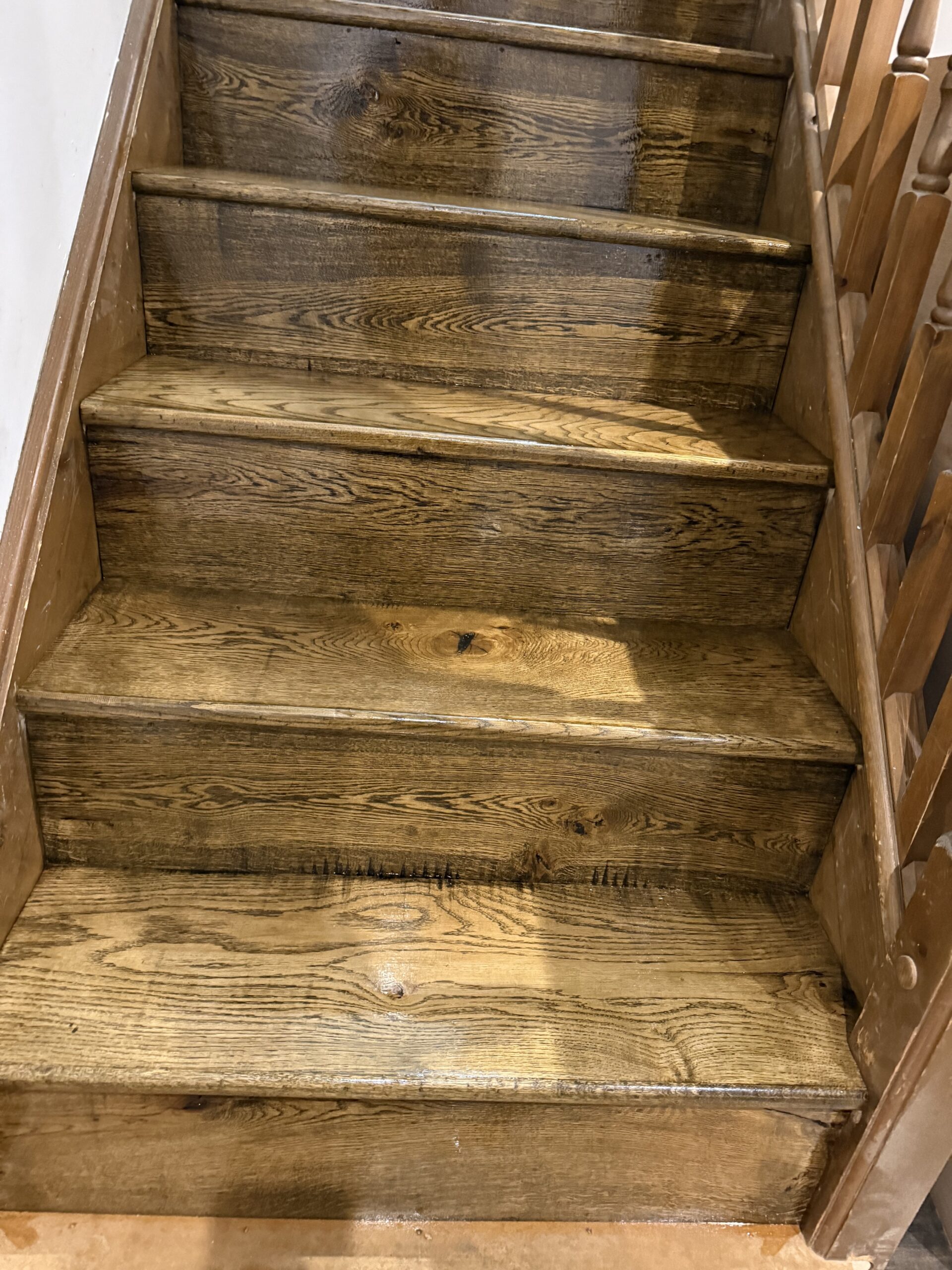 Wooden staircase with dark stained timber steps indoors