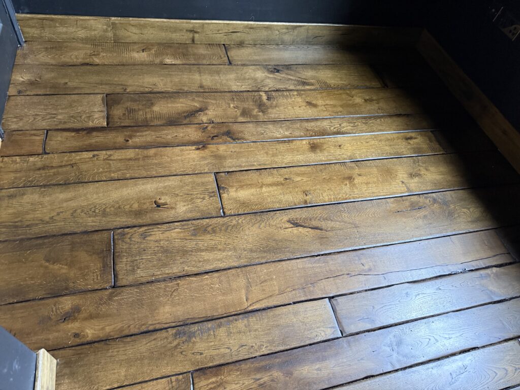 Hardwood timber flooring with random width planks and natural grain