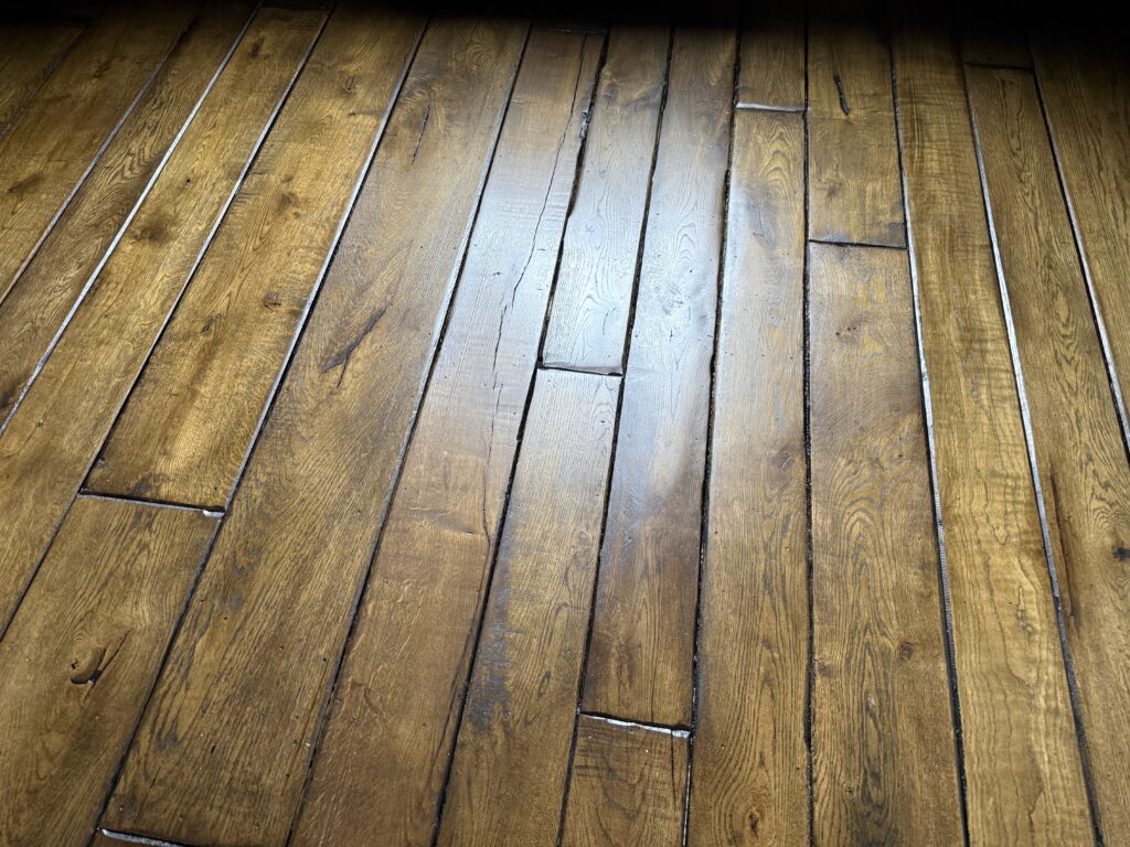 Wooden hardwood flooring with staggered plank pattern