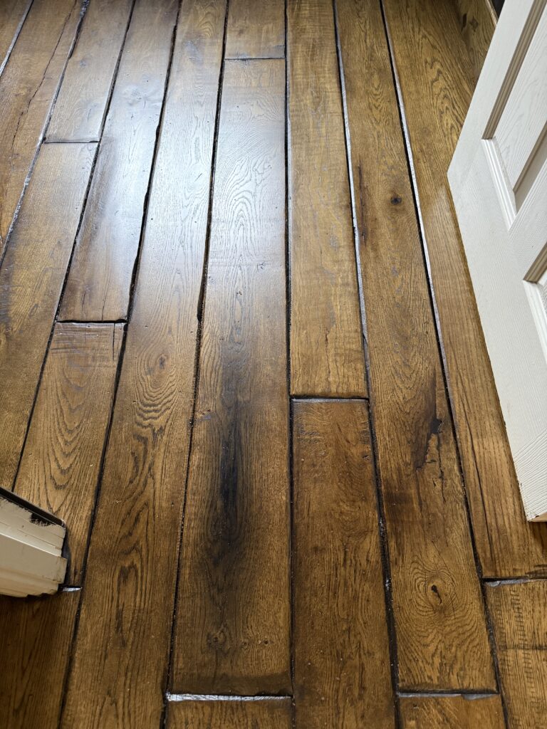 Brown hardwood floor with random plank pattern layout
